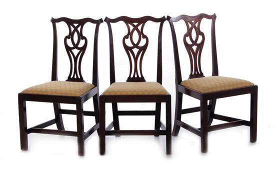 Appraisal: Three Georgian style mahogany chairs circa strapwork back slip seat