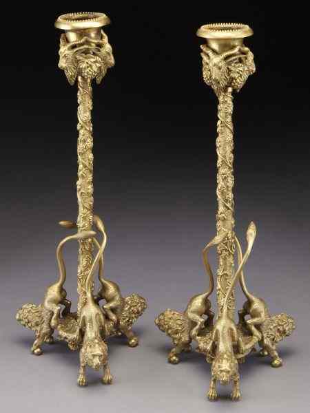 Appraisal: Pr Continental dore bronze candlestickshaving rams' head decorated candle cups