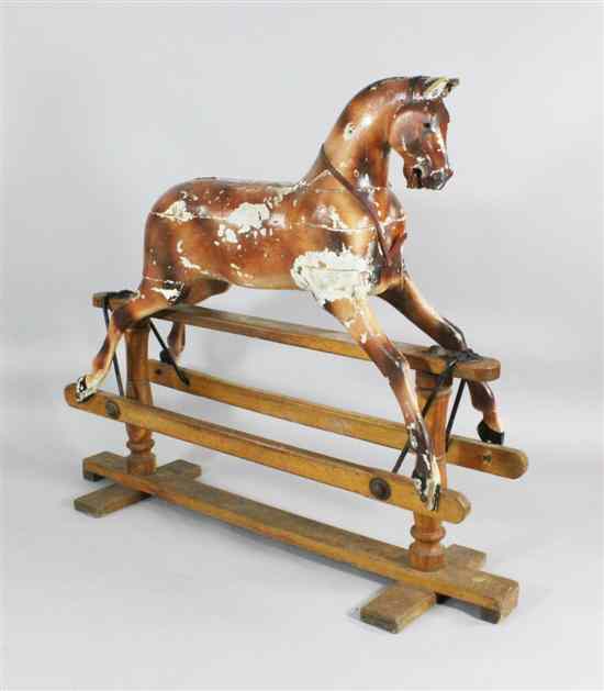 Appraisal: A Victorian carved pine and painted gesso rocking horse on