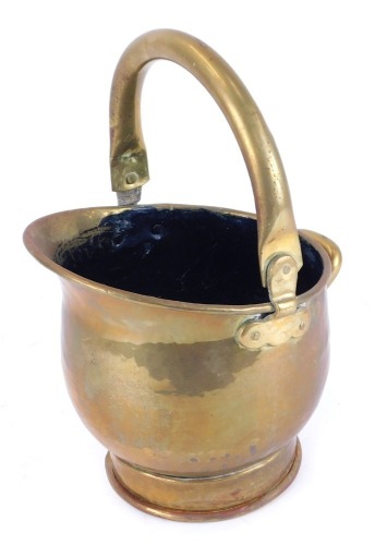 Appraisal: An early thC brass helmet shaped coal bucket with a