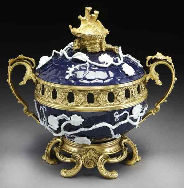 Appraisal: French ormolu mounted porcelain potpourri the blue ground with raised