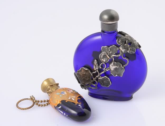 Appraisal: A modern flask with silver floral overlay and a 's