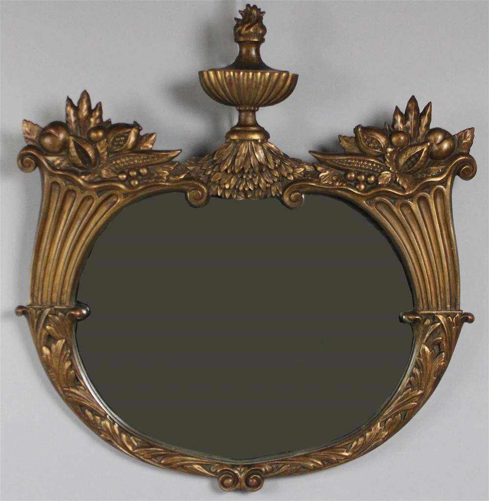 Appraisal: NEOCLASSICAL STYLE CARVED GILTWOOD OVAL MIRROR having an urn shaped