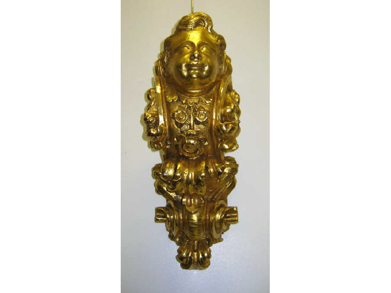 Appraisal: CONTINENTAL ARCHITECTURAL BRACKET Rococo style gilt gesso carved wood cherub