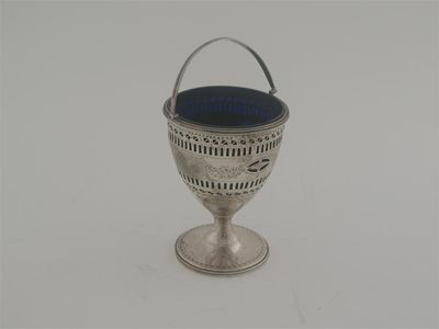 Appraisal: A George III vase-shaped sugar basket with pierced and engraved