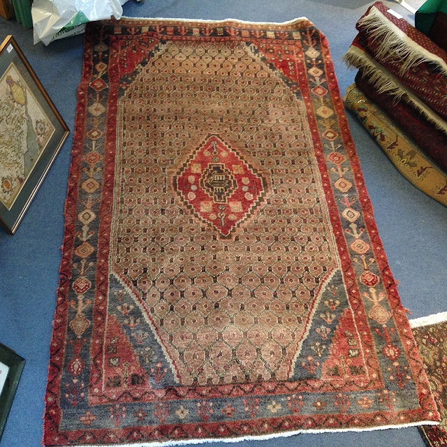 Appraisal: A PERSIAN HAMADAN TRIBAL RUG with central medallion within a