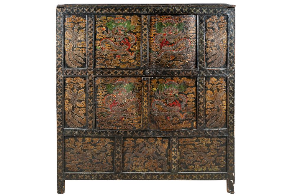 Appraisal: TIBETAN CARVED POLYCHROMED WOOD CABINETthe rectangular case enclosing a pair