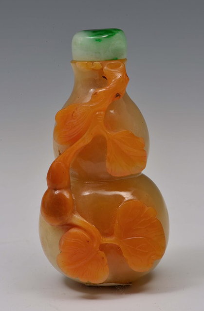 Appraisal: A CHINESE ORANGE AND CAFE-AU-LAIT SNUFF BOTTLE of double gourd