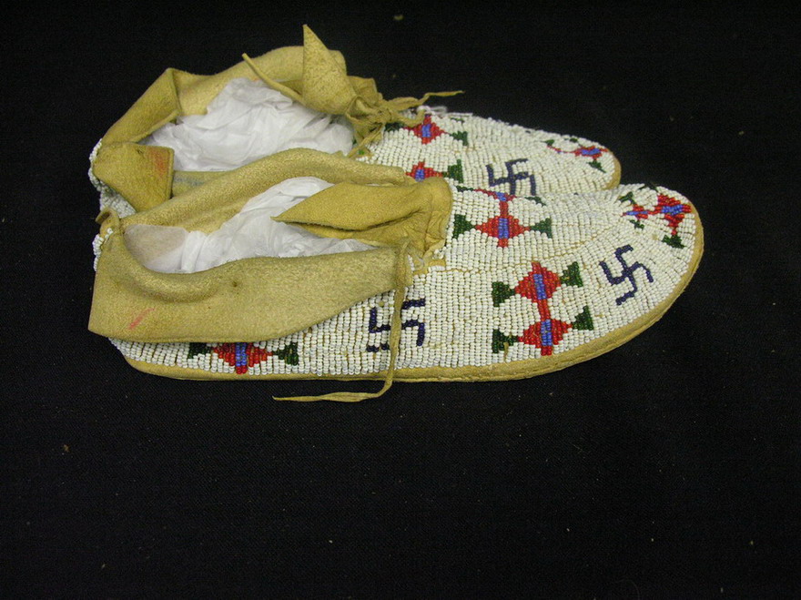 Appraisal: NATIVE AMERICAN BEADED MOCCASINS Hand sewn brain tried leather hand