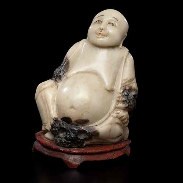 Appraisal: Chinese Soapstone Buddha Chinese th century A carved soapstone Buddha