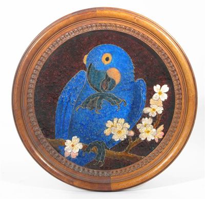 Appraisal: An enamel roundel decorated with a parrot resting on a