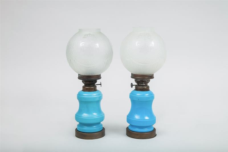 Appraisal: Two Similar Victorian Blue Glass Oil Lamps With globe shades