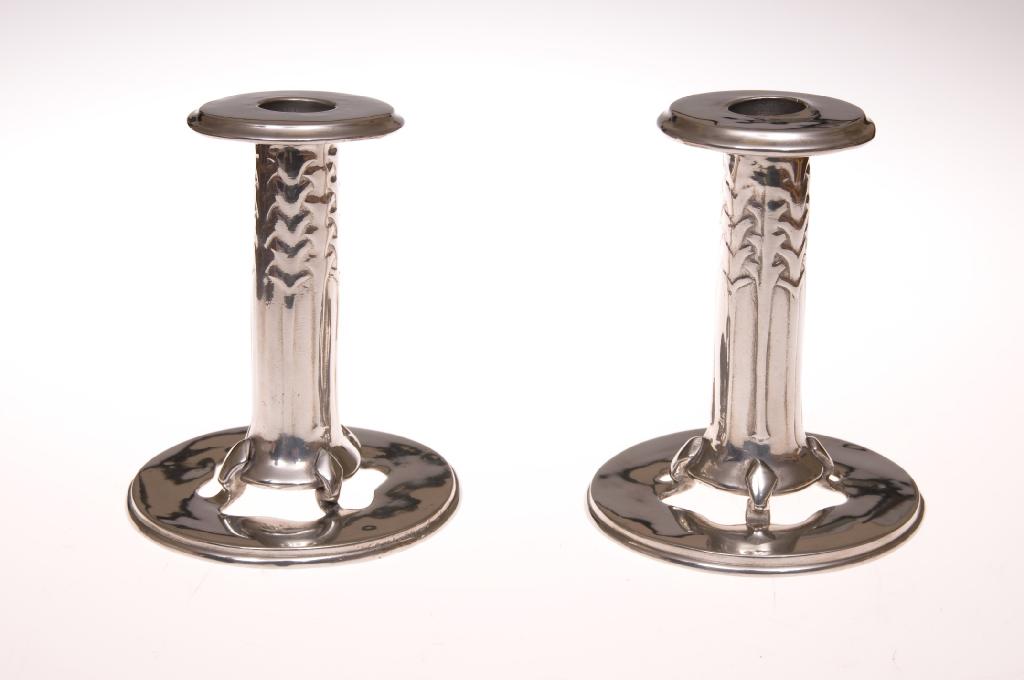 Appraisal: PAIR OF LIBERTY CO TUDRIC PEWTER CANDLESTICKS DESIGNED BY ARCHIBALD