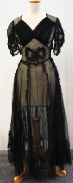 Appraisal: Ball gown in black net with diamante accents to the