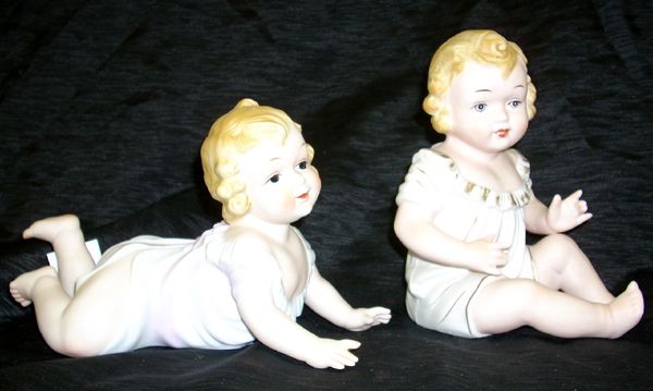 Appraisal: Pair of KPM Polychromed Biscuit Porcelain Piano Baby Figures first