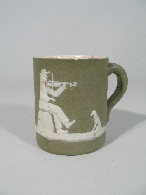 Appraisal: NC Pottery Pisgah Forest Cameo Mug matte green w white