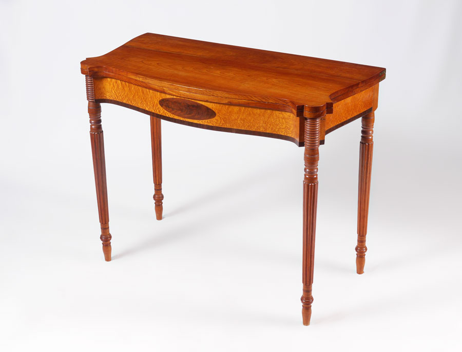 Appraisal: MAHOGANY AND MIXED WOOD GAME TABLE Shaped flip top with