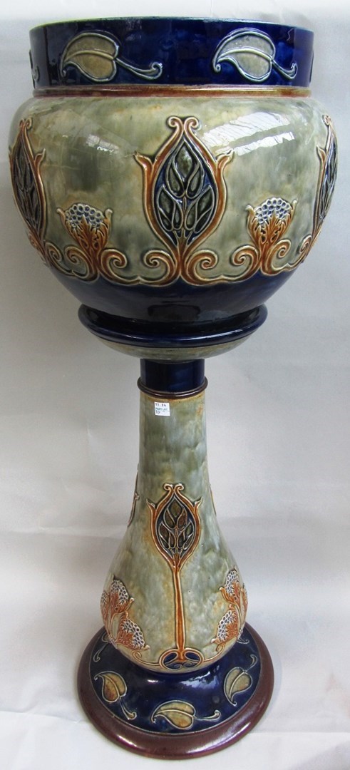 Appraisal: A Royal Doulton saltglaze stoneware jardiniere and stand early th