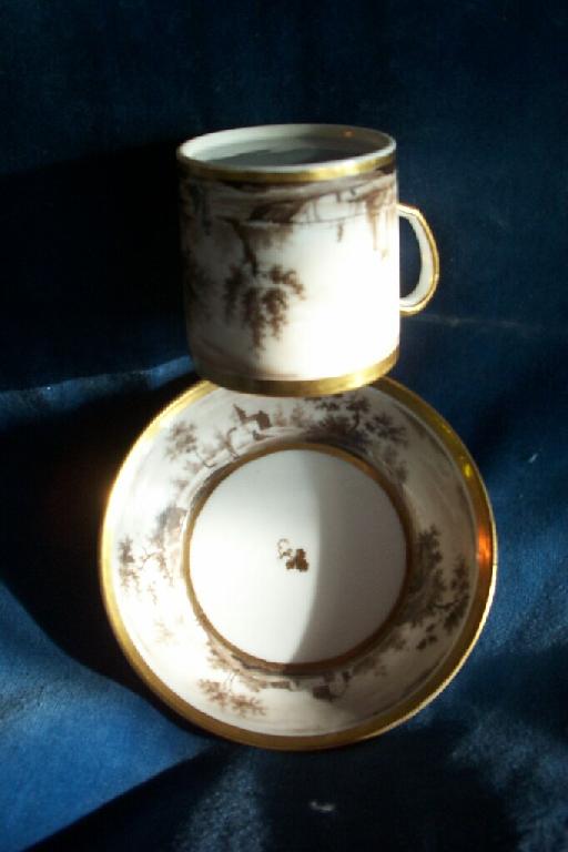 Appraisal: An early th century coffee can and saucer with continuous