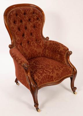 Appraisal: A Victorian walnut button back armchair on cabriole legs