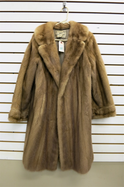 Appraisal: LADY'S MINK COAT having light brown fur two exterior pockets