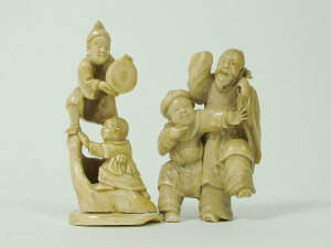 Appraisal: A Japanese ivory figure group of two men height cm