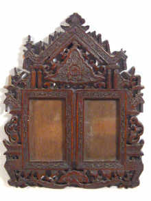 Appraisal: A carved double photo frame in Oriental hardwood measurements cm