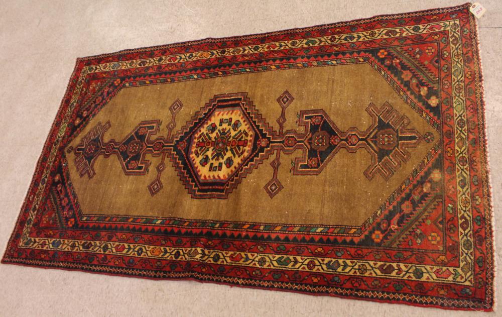 Appraisal: SEMI-ANTIQUE PERSIAN AREA RUG geometric pole medallion on plain camel