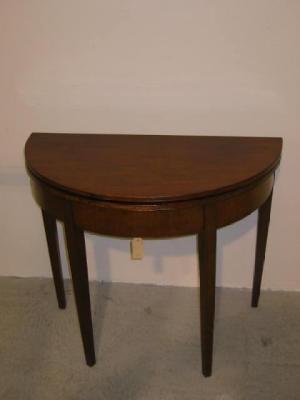 Appraisal: A GEORGE III MAHOGANY TEA TABLE of demi lune form