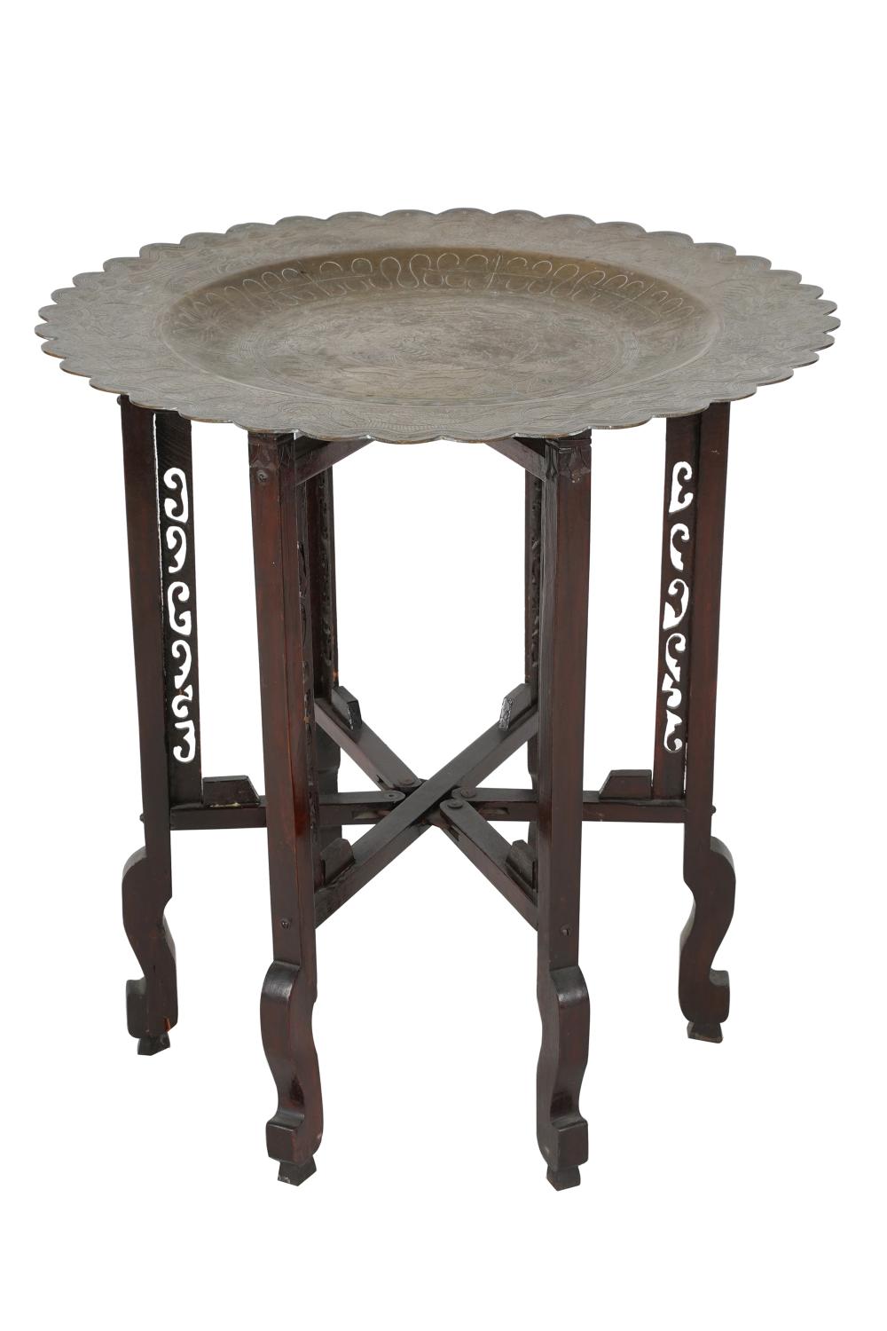 Appraisal: ETCHED BRASS CARVED WOOD TRAY TABLEthe round top with scalloped