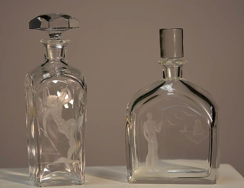 Appraisal: Etched Decanters one Orrefors Two etched decanters one Orrefors with