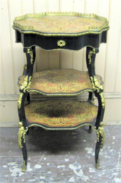 Appraisal: Boulle marquetry and ebonized etagere The gallery shaped oval top