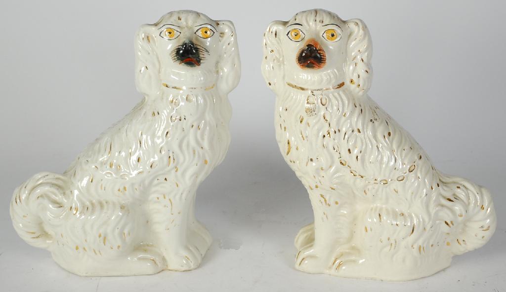 Appraisal: PAIR OF th CENTURY STAFFORDSHIRE POTTERY MANTEL DOGS with gilt