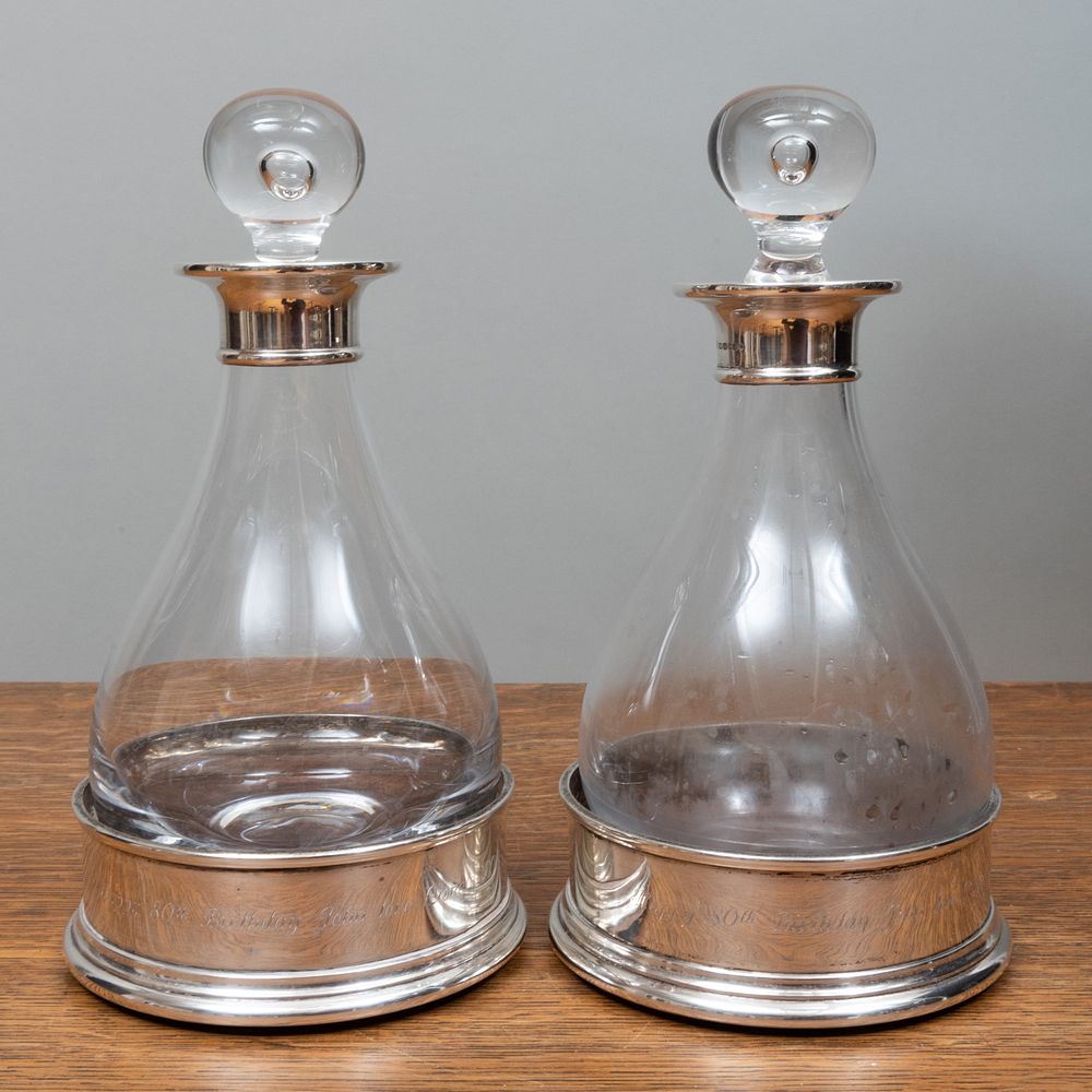 Appraisal: Pair of English Silver Bottle Coasters Together with Two Decanters