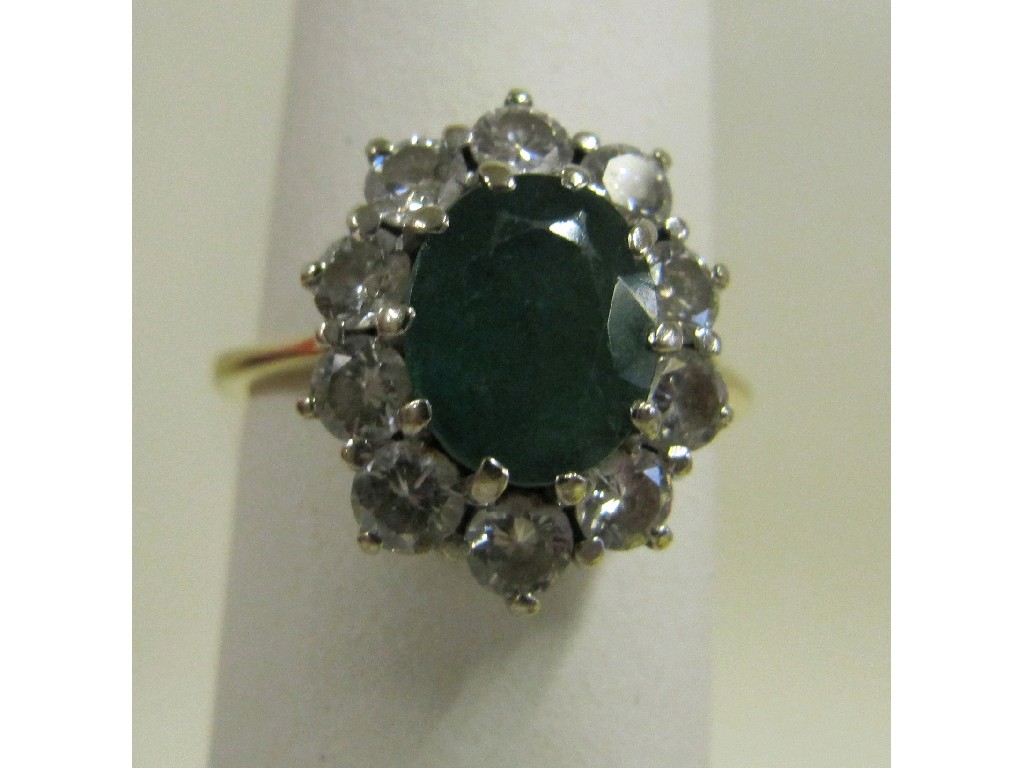 Appraisal: Eighteen carat gold emerald and diamond cluster ring with approx