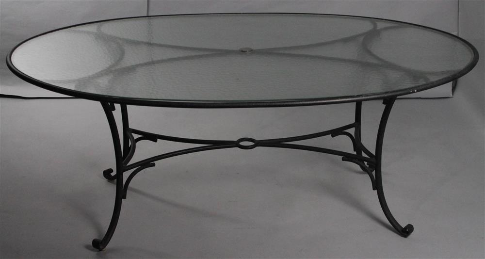 Appraisal: OVAL GLASS-TOPPED GARDEN METAL DINING TABLE modern oval frosted glass