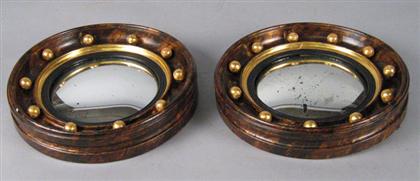 Appraisal: Pair of small grained and parcel gilt convex mirrors Each