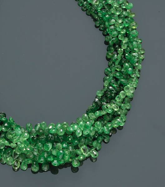 Appraisal: A tsavorite bead and diamond torsade necklace mounted in eighteen