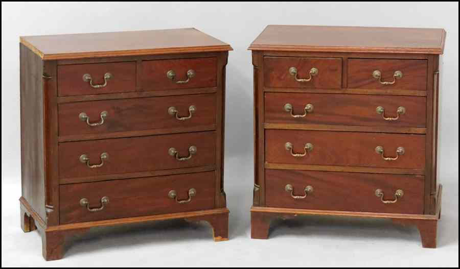 Appraisal: PAIR OF ENGLISH GEORGIAN MAHOGANY FOUR-DRAWER BACHELOR CHESTS Raised on