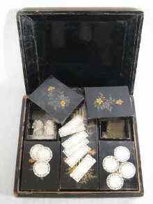 Appraisal: A black lacquered case with five internal boxes containing about