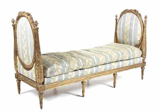 Appraisal: A Louis XVI Style Giltwood Daybed having foliate carved crest