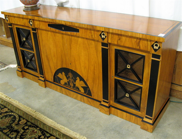 Appraisal: BIEDERMEIER STYLE PARCEL-EBONIZED MAPLE BUFFET th century the front featuring