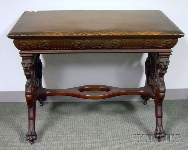 Appraisal: Late Victorian Carved Mahogany Griffin-base Library Table with Drawer ht