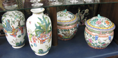 Appraisal: TWO PAIR OF CHINESE PORCELAINS covered cache pots with foo