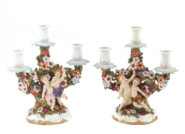 Appraisal: A pair of Dresden porcelain figural three light candelabra height