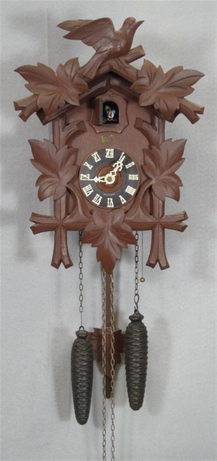 Appraisal: Carved Black Forest cuckoo clock bird oak leaf crest weights