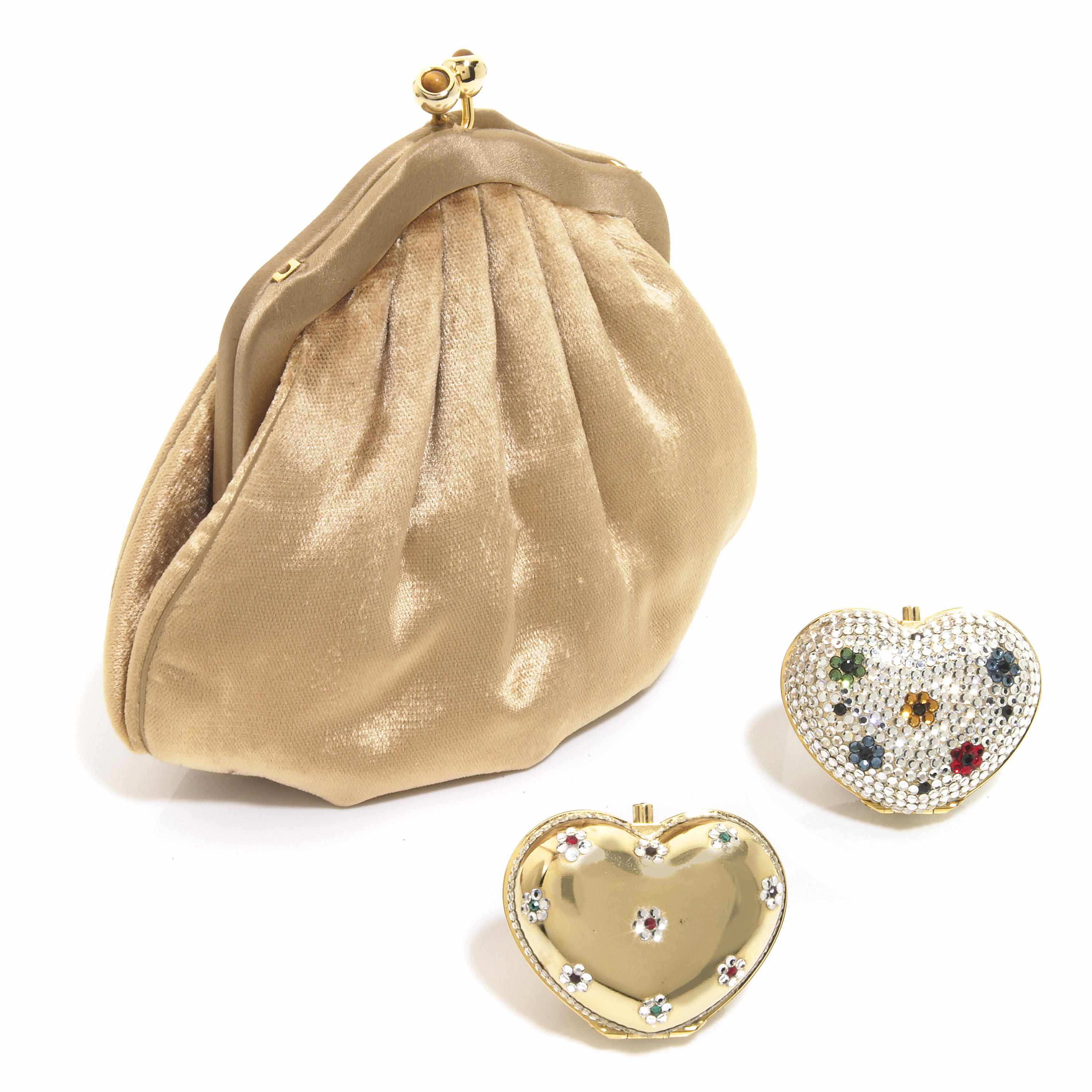 Appraisal: A gold colored velvet purse together with two crystal heart-shaped