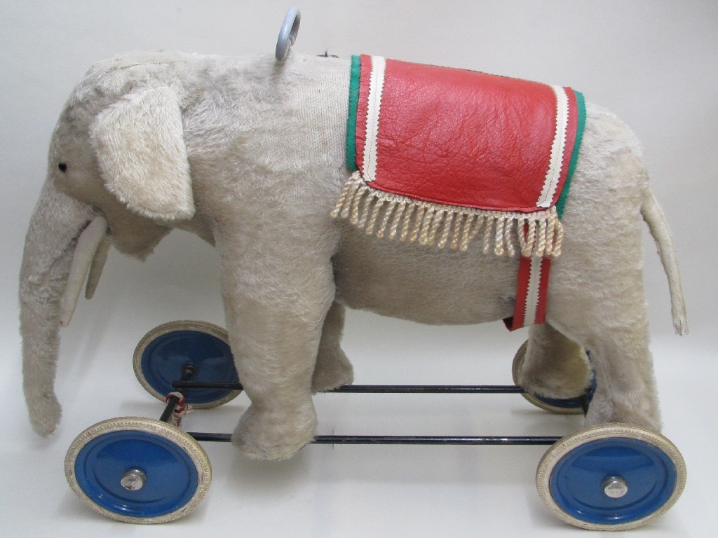 Appraisal: A Steiff push along plush elephant with leather caprison cm