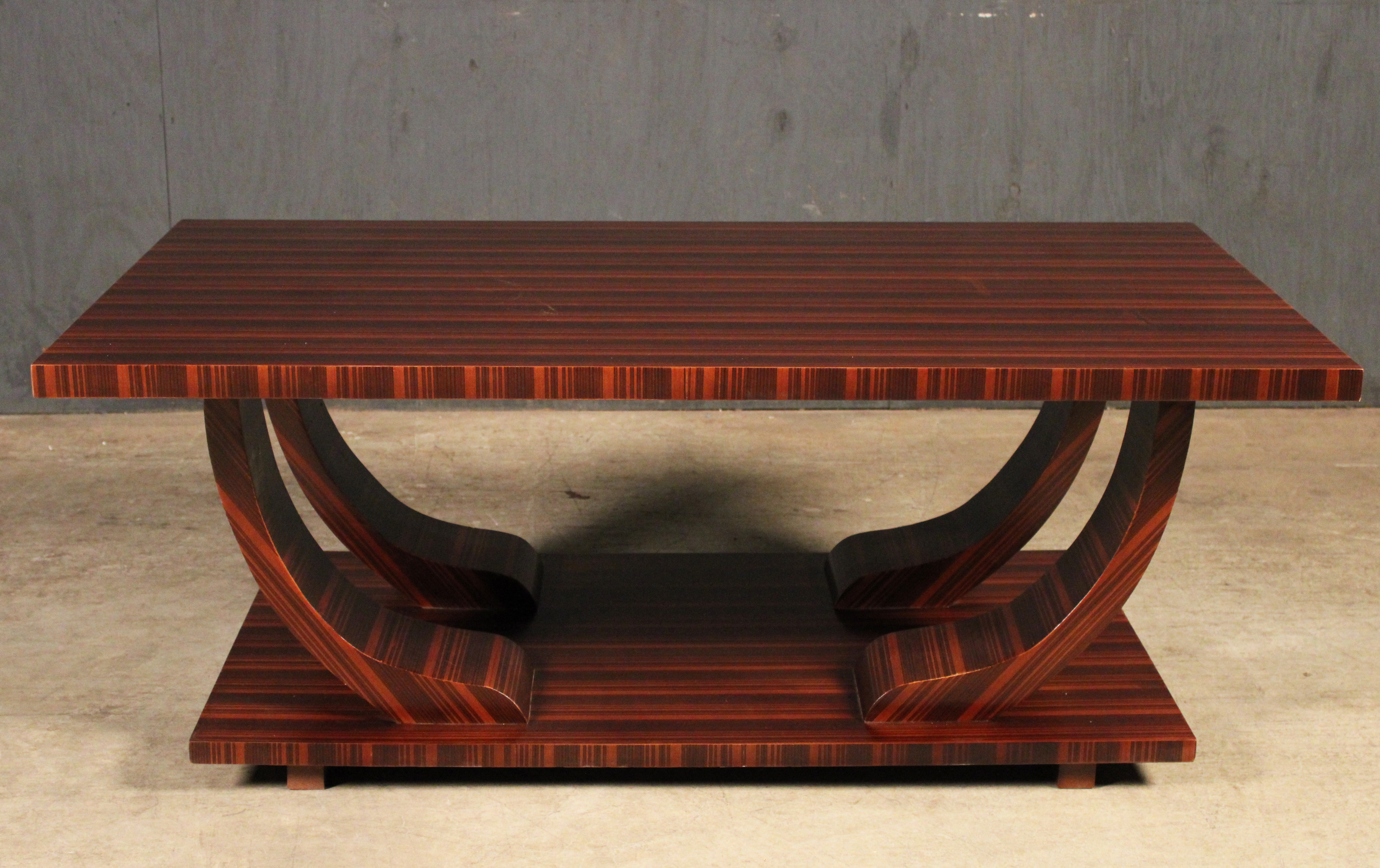 Appraisal: CONTEMPORARY ROSEWOOD VENEERED COFFEE TABLE Contemporary rosewood veneered coffee table