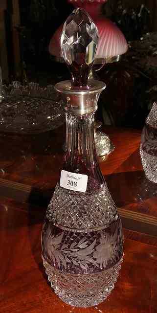 Appraisal: A PURPLE FLASH AND CUT GLASS DECANTER with silver mounted